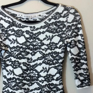 Angelica-Val Cream & Black Floral And Lace Top